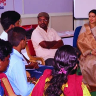 Children taking part in a Sneha Shibira life-skills activity, faces not shown. Interim scan from the 2019-2024 impact book